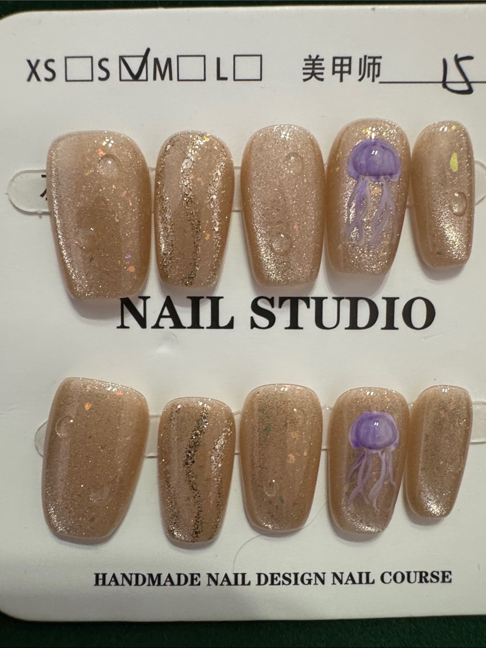 Handmade Shimmery Nude Press-On Nails with Purple Jellyfish Accent